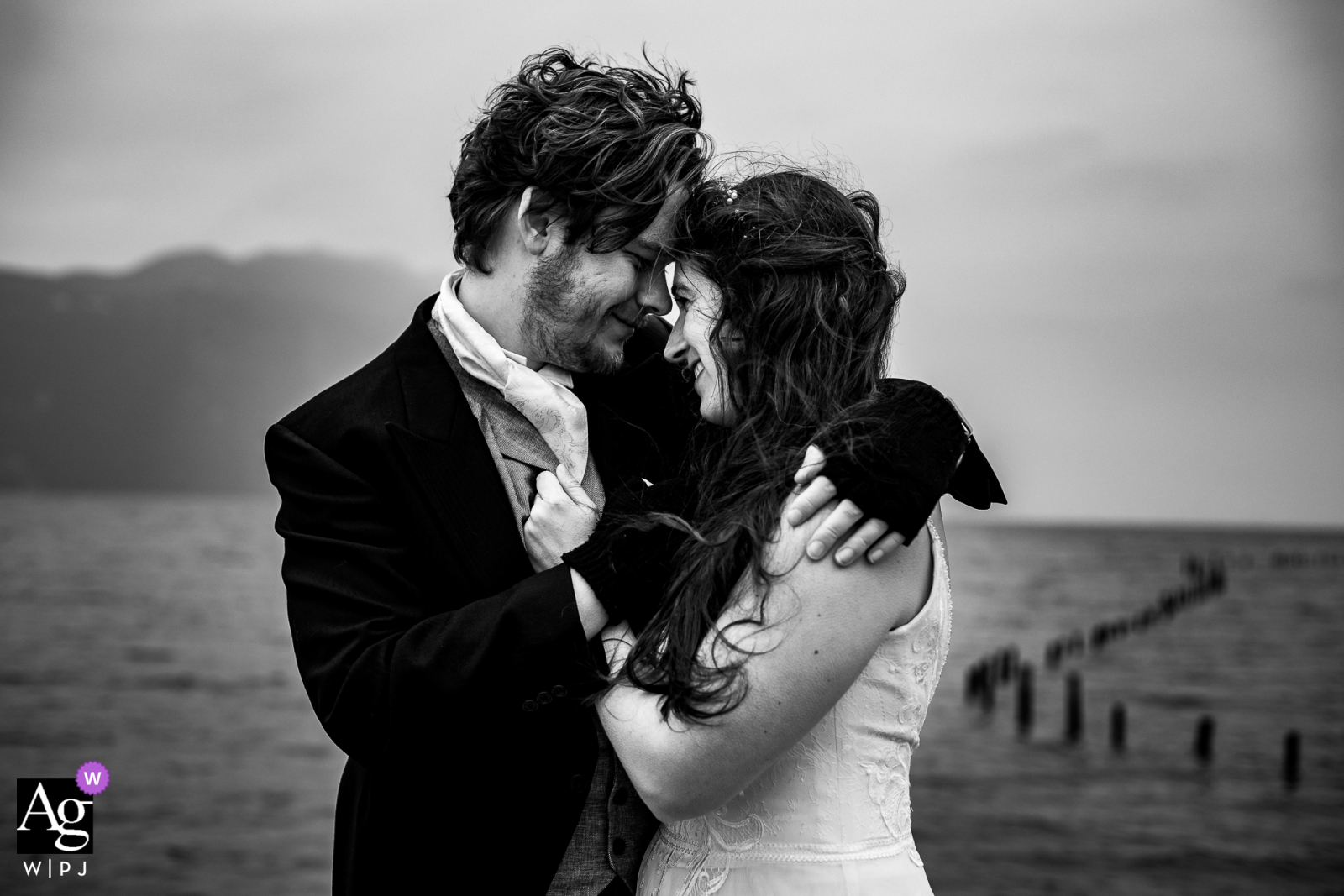 Aix-les-Bains wedding couple artistic image session of the couple embracing near the sea