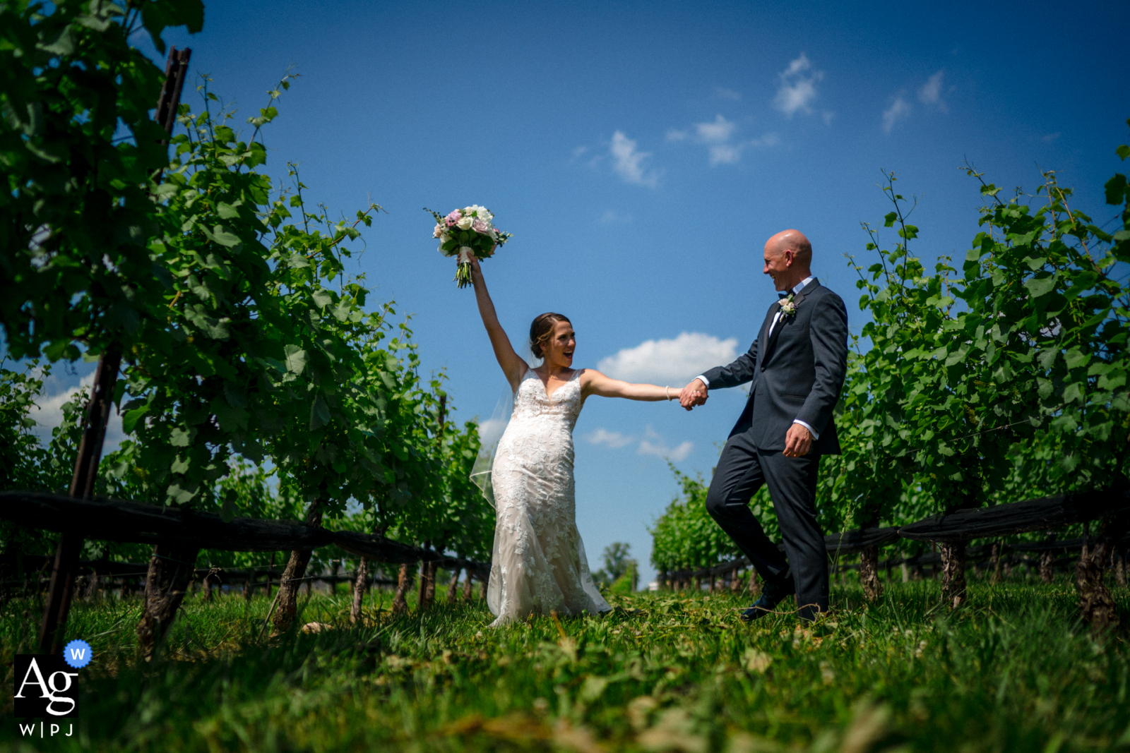 Stone Tower Winery, Virginia wedding couple artistic image session with a bride and groom dancing through a vineyard