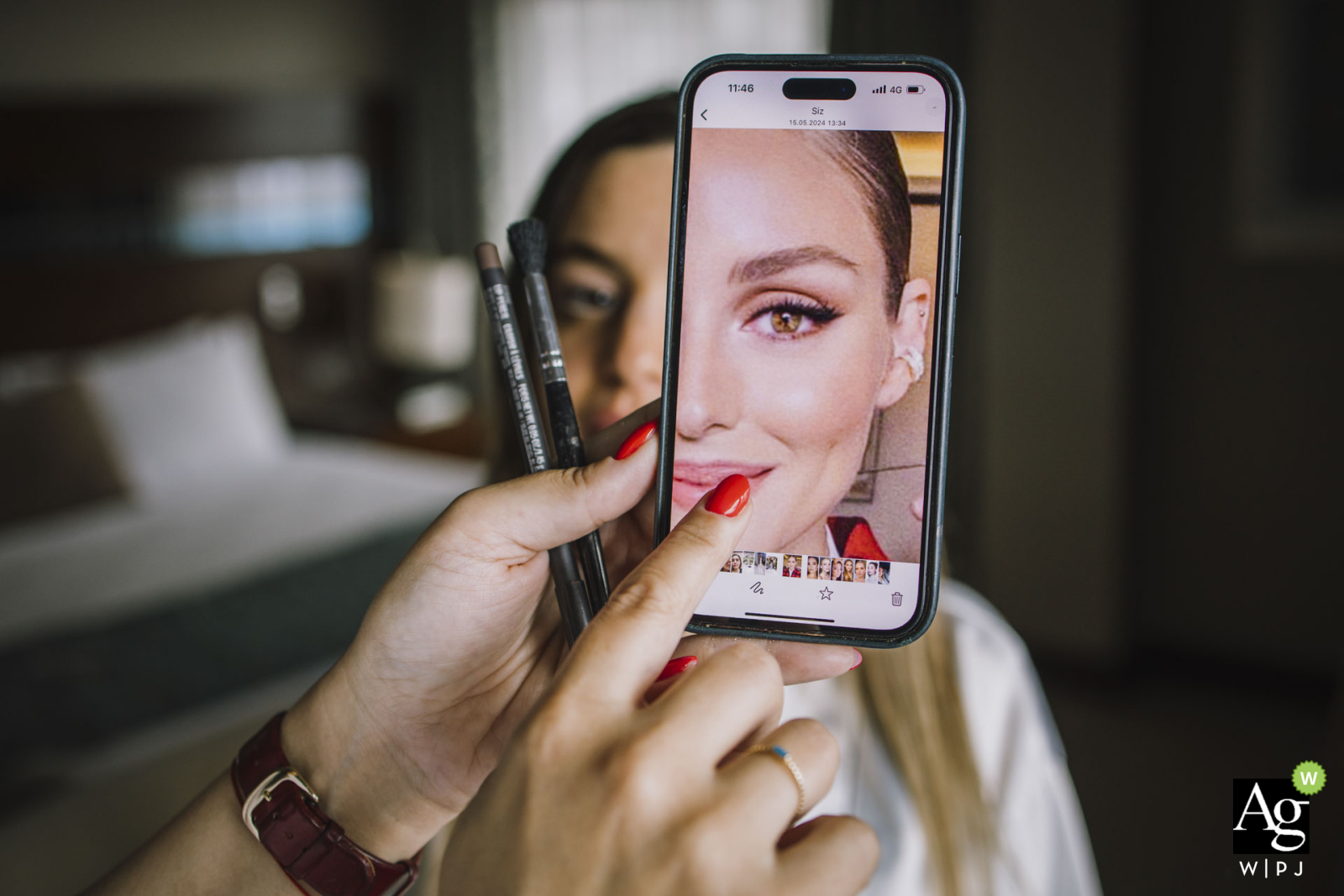 At Mersin Hilton Hotel, the bride and her makeup artist look at Pinterest for inspiration. They share ideas and excitement as they prepare for the big day, ensuring everything is perfect.