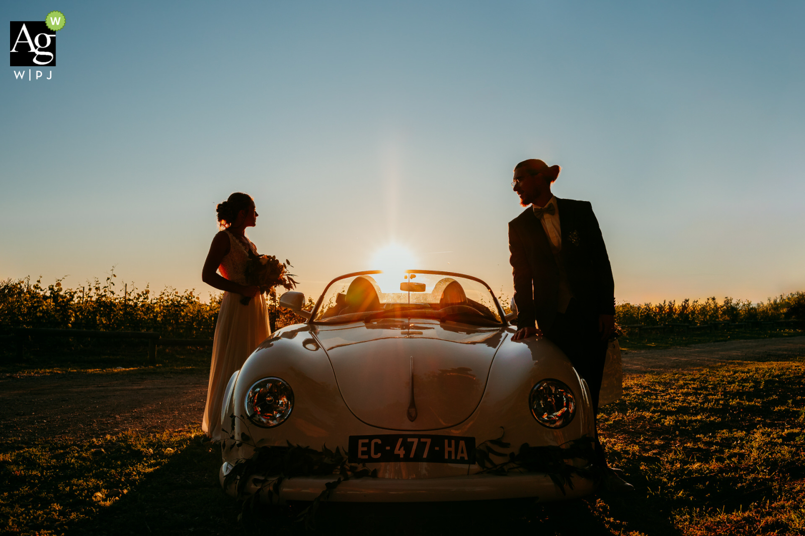 Sunset Dreams: Bride & Groom, Vintage Porsche, Domaine de la Clausade Outside at Domaine de la Clausade Mauguio, the bride and groom pose with a vintage convertible Porsche during their sunset couple session.