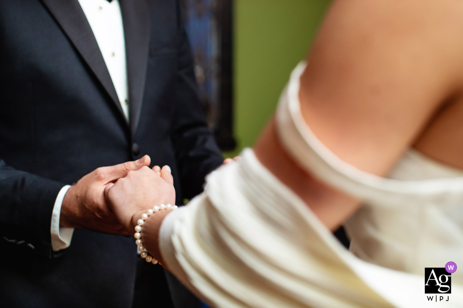In Westfield, New Jersey, a heartfelt moment unfolds as the bride and groom hold hands during their intimate elopement.