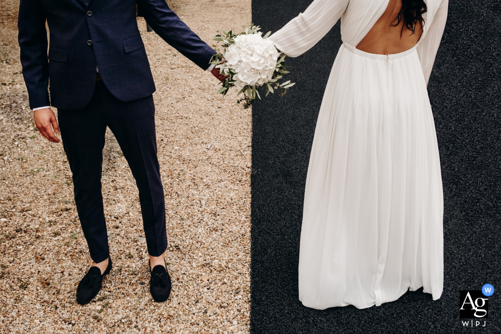 On the steps of the town hall in Châteauroux, the newlyweds stand out vividly against the contrasting patterns and textures of the ground, creating a striking visual composition in front of the historic building.