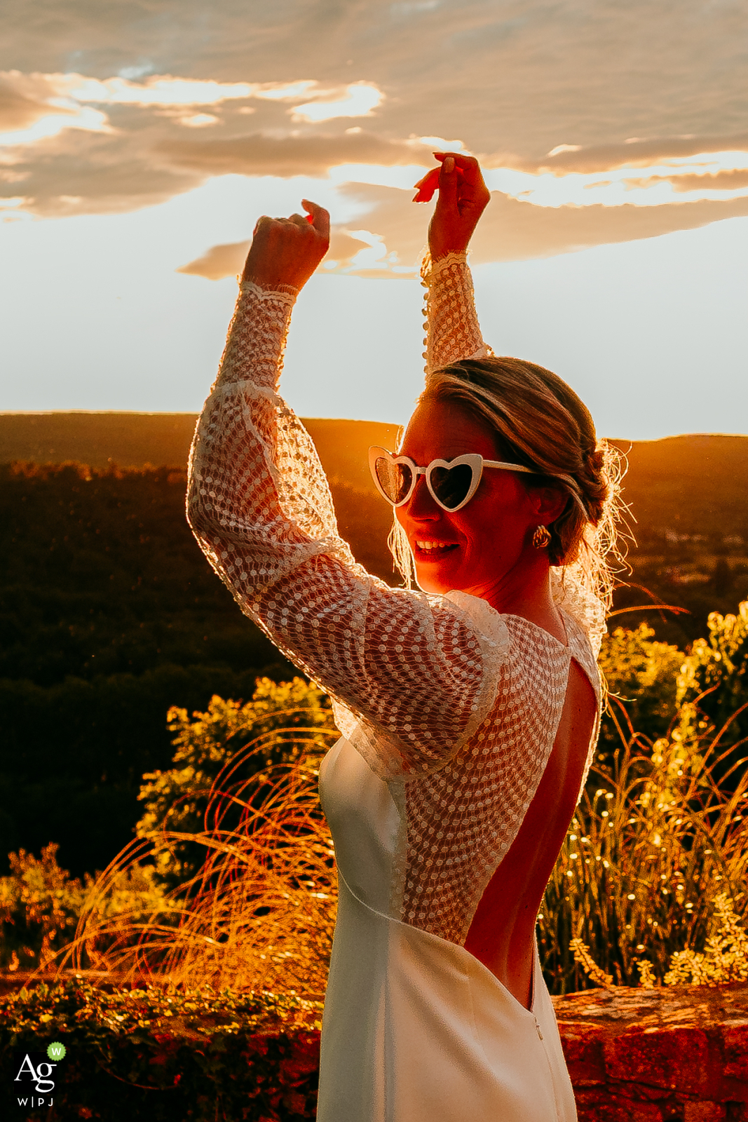 Golden hour bride dances joyfully at Domaine de Gressac, bathed in warm, ethereal light