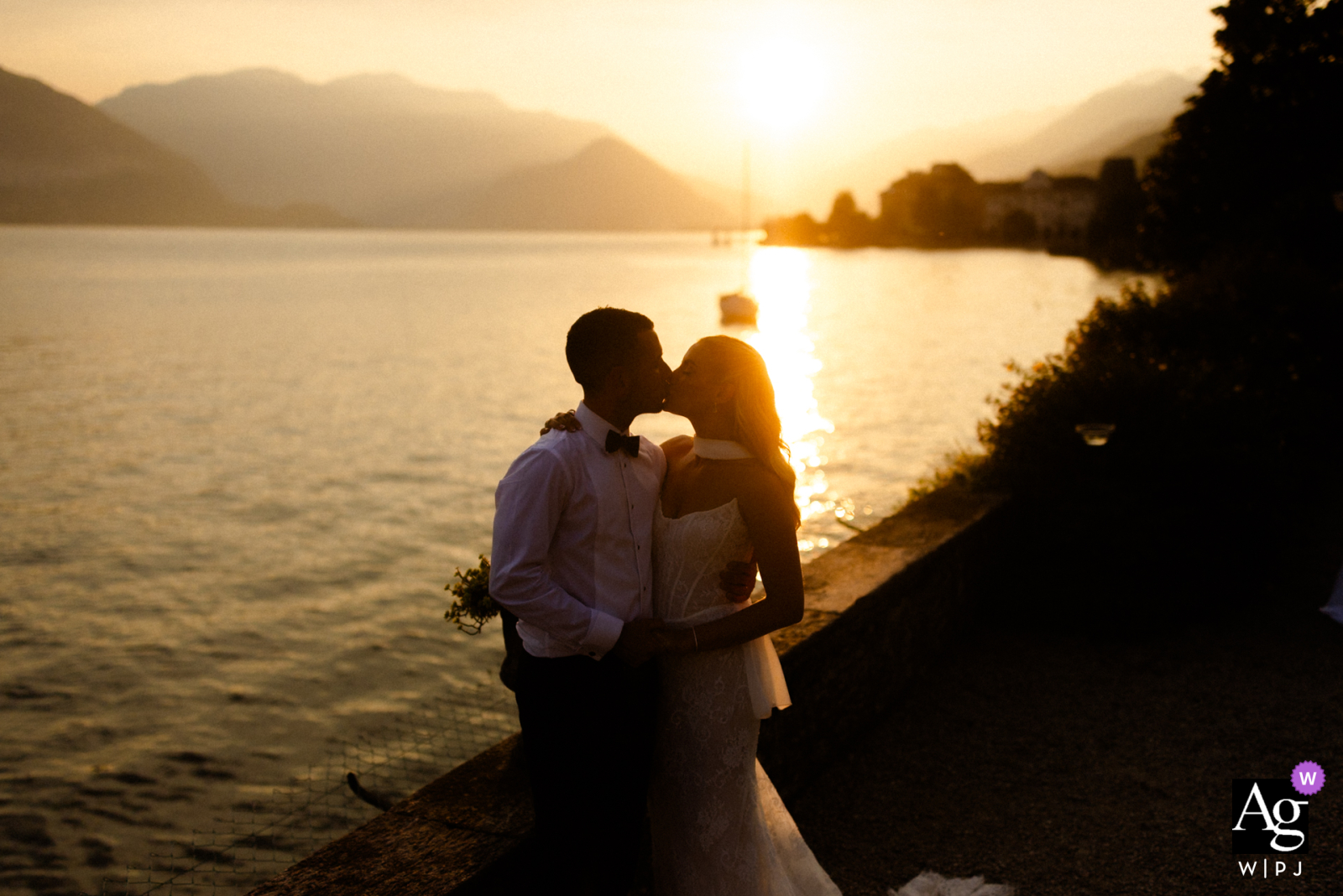 Villa Rusconi Clerici, Lake Maggiore, Italy: A stunning sunset silhouettes a couple against the water.