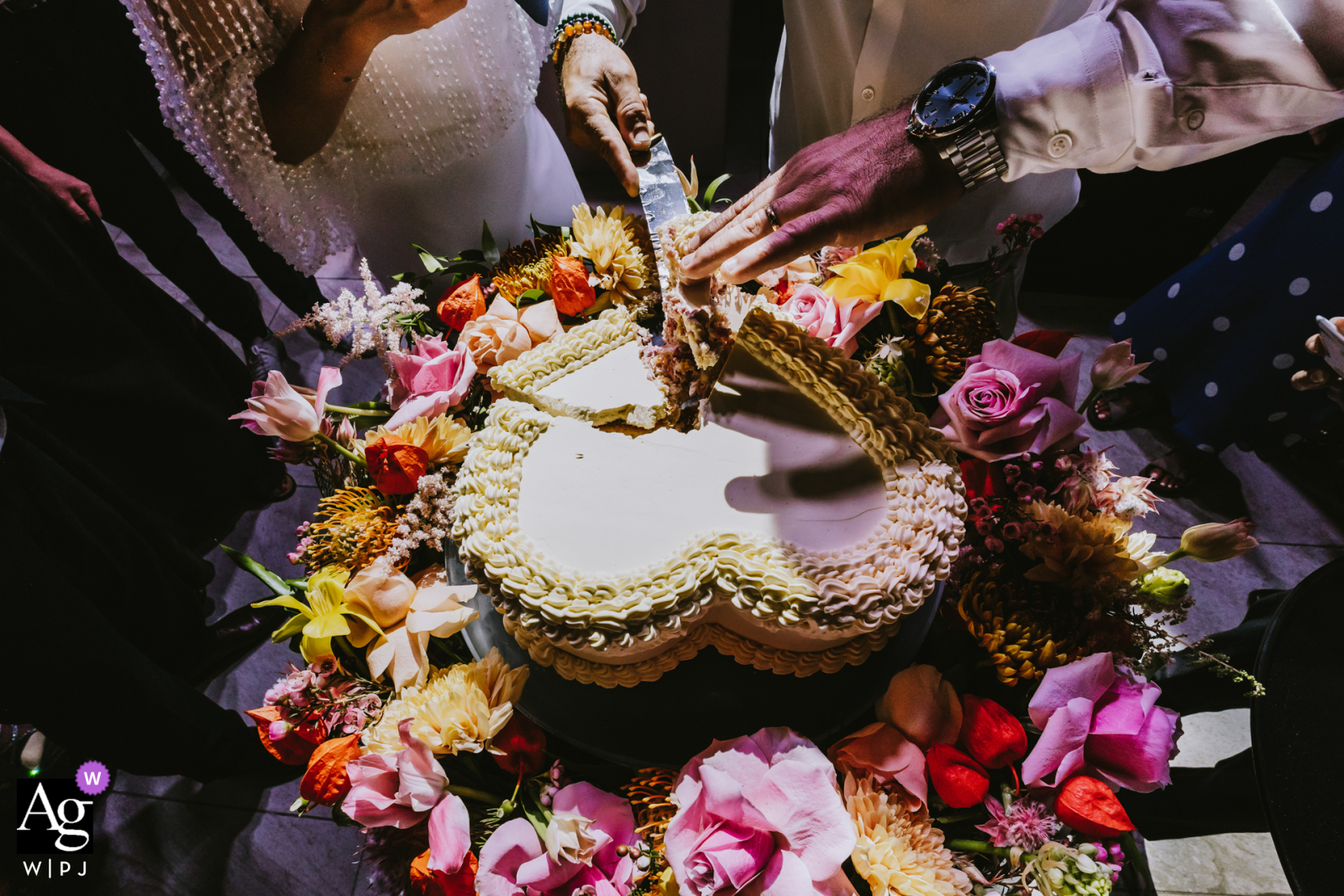 Parma Sole, Istanbul wedding details show the elaborate cake and the bride and groom's hands cutting it together