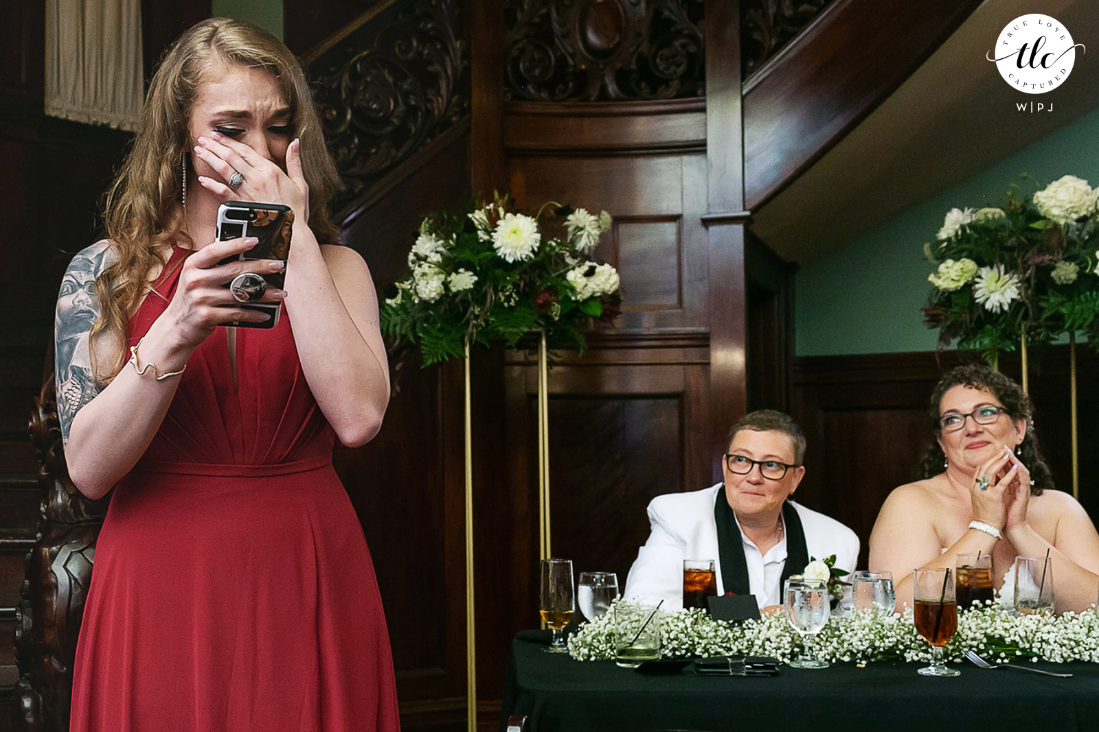 A truthful report of raw emotions in a Rhodes Hall wedding day image captured by a Atlanta, Georgia documentary wedding photographer showing a Daughter giving toast at her Moms wedding 