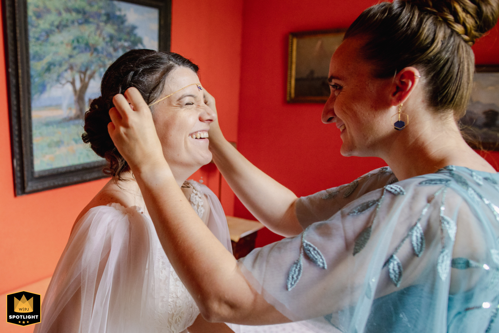 Bride Dressing with Maid of Honor in Poitiers At the reception venue in Poitiers, Vienne, the bride gets dressed with the help of her maid of honor, capturing a tender moment of friendship and anticipation before the wedding ceremony.