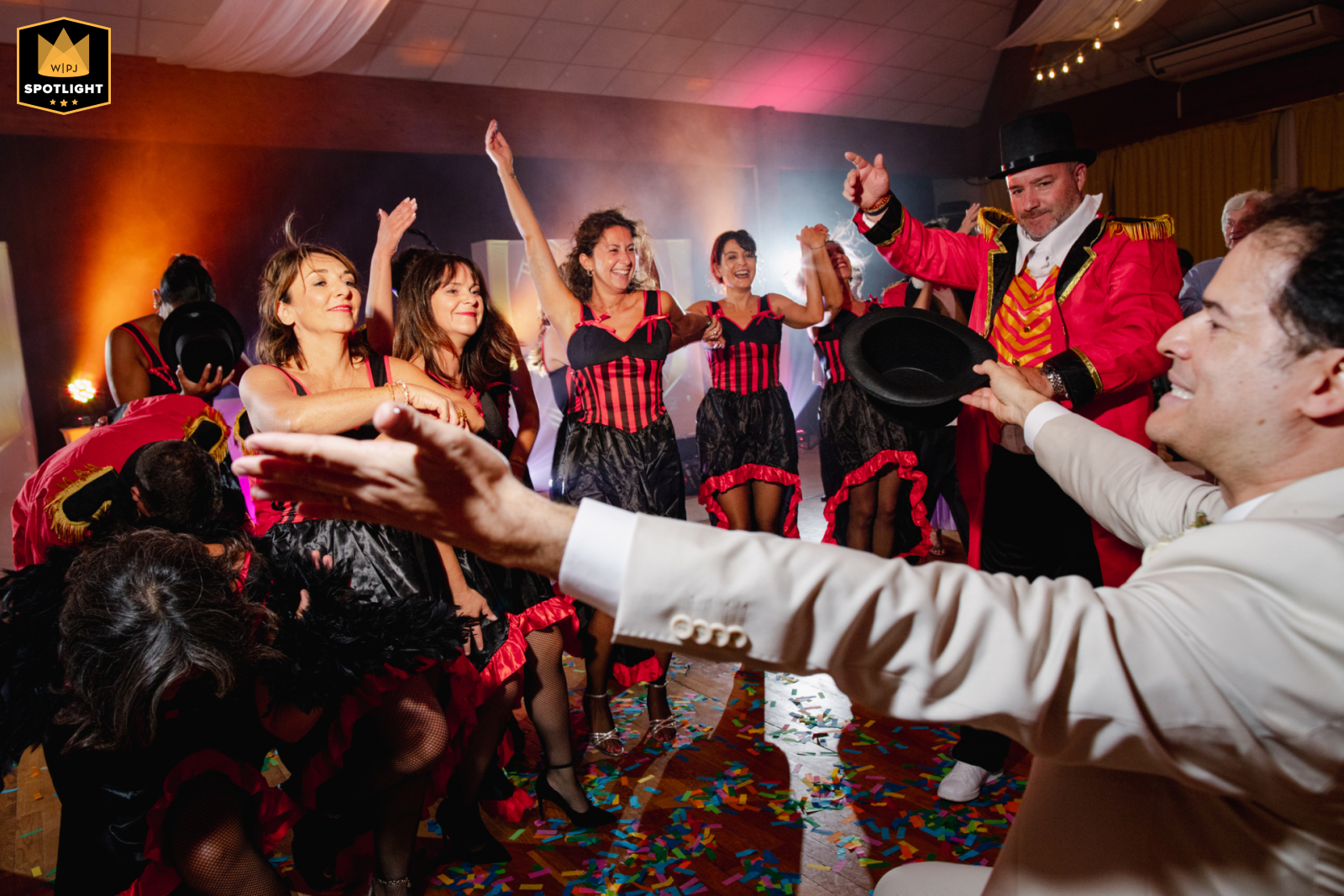 At the reception in Poitiers, Vienne, the groomsmen perform a lively Moulin Rouge dance as they enter the room, adding excitement and entertainment to the wedding party.