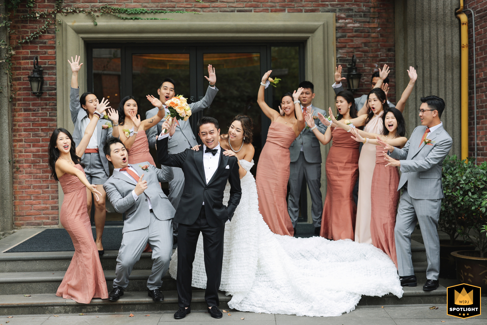 Newlyweds and joyful bridal party celebrate together at InterContinental Ruijin Shanghai, China, surrounded by laughter, love, and happiness.