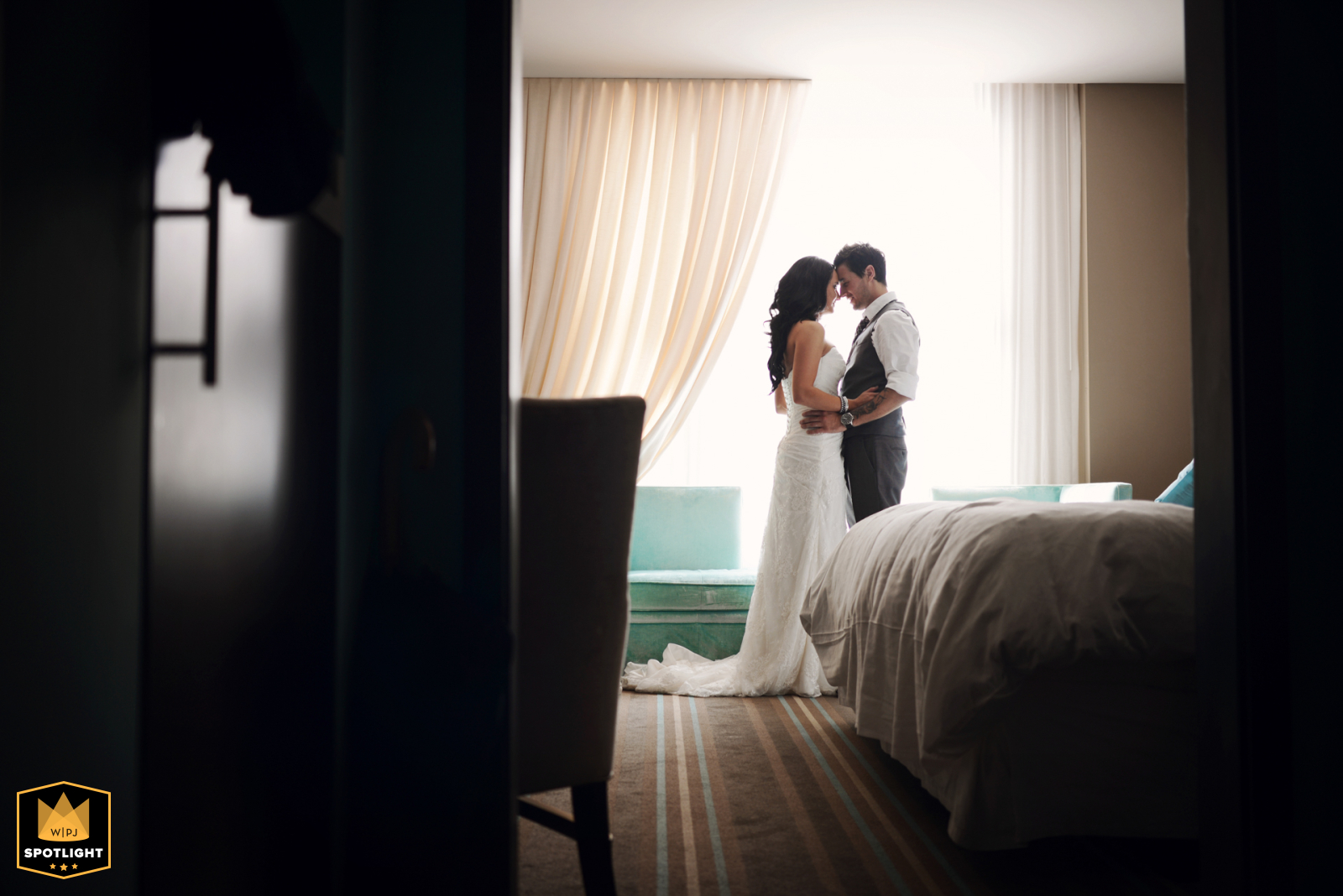 At The Nines hotel in Downtown Portland, Oregon, the bride and groom are in their hotel suite on their wedding day.