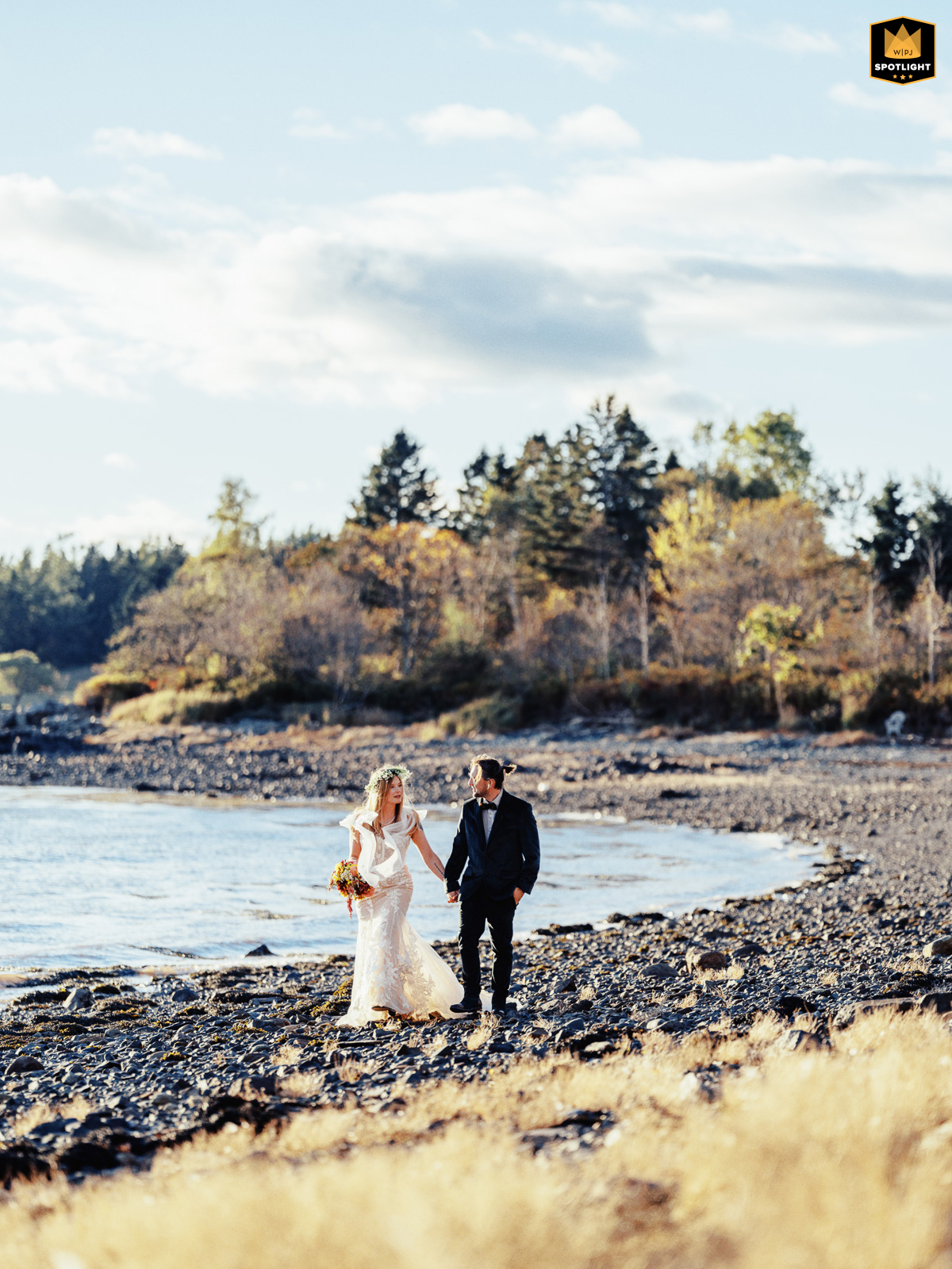 In Eastport, Maine, a couple strolls hand in hand along the rocky shoreline at the easternmost edge of the United States. Surrounded by rugged natural beauty, their walk captures a spirit of adventure and togetherness.