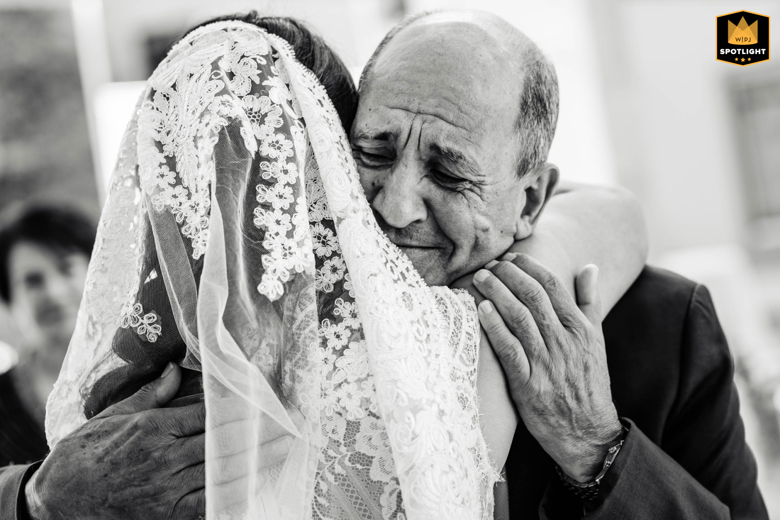 At The Drake Hotel in Oak Park, IL, the bride embraces her father tightly upon seeing him for the first time on her wedding day. Their emotional hug beautifully captures the love and excitement of this heartfelt moment.