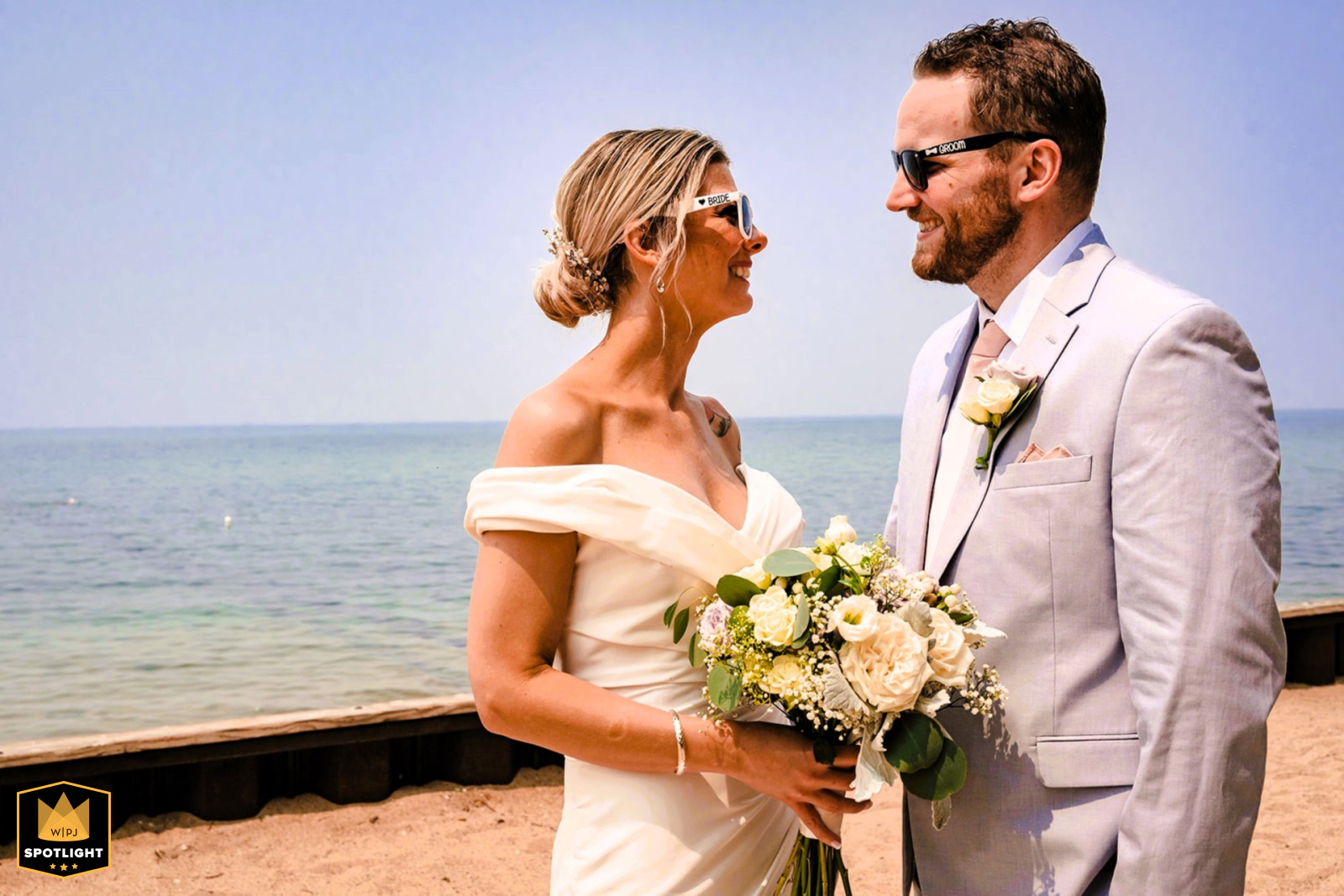 In Lake Tahoe, California, the newlyweds stand under the blazing sun rocking their sunglasses.