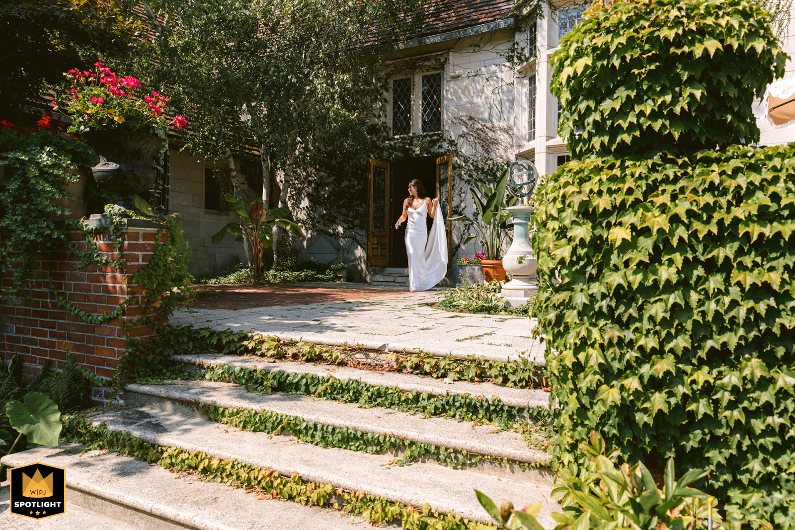   In Cape Elizabeth, Maine, the bride lifts her dress as she approaches the groom blending excitement with a touch of playful elegance.