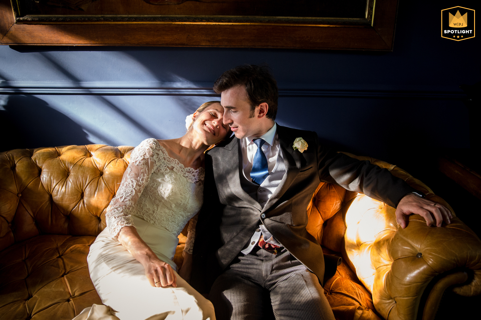 Couple Relax Together On A Sofa Outside A Church Near Gers, France Seated together on a sofa at a church near Chateau de Lartigolle in Gers, France, the couple enjoys side by side time in the sunlight amid their special day.