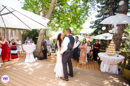 The couple shared their first dance on the deck of their backyard brunch wedding, a sweet and intimate elopement for friends and family to celebrate their special day