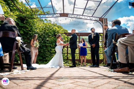 Outdoor Wedding Pictures | The wedding guests wait on the rooftop for the ceremony to begin