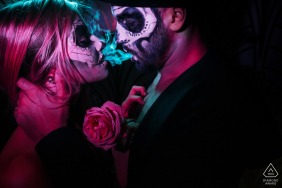 Creative engagement portrait of a love story in the style of a carnival of death