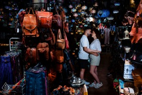 True Love Pre-Wedding Portrait Session in Granada, Spain illustrating a couple at the open market of bags