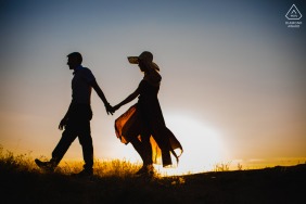 Cappadocia couple prewed engagement session walking by the backlight