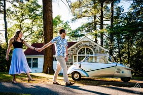 Basin Harbor, Vermont couple e-shoot while walking the grounds near the tall trees