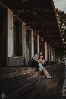 Costa Rica bride and groom to be, modeling for a pre-wedding picture at the Atlantic Railroad station in San Jose while having fun on the stairs