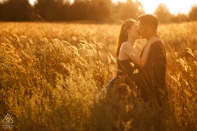 Melaka picture session for a carefree engaged couple that is loving the tall grass sunshine session