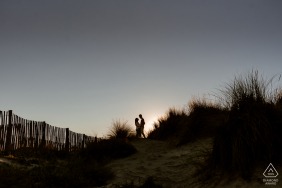 Scenic Montpellier engagement picture for a France couple enjoying the sunset by the grass