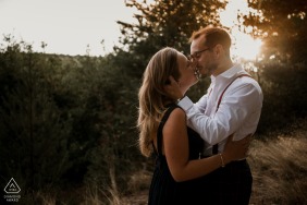 A couple embracing at Chartres during the golden hour will soon be getting married