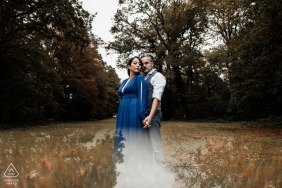 In Chartres, an affectionate couple embraces and snuggles in the forest during the beautiful autumn season, captured by a talented engagement photographer from Chartres.