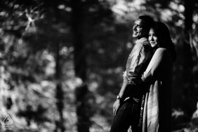 Near the busy city of Oakland, a loving couple's engagement portrait was taken amongst the peaceful, dappled sunlight of a forest. 