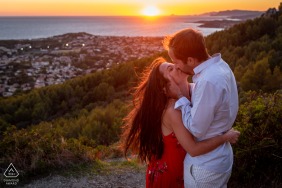 Soft light illuminates a couple kissing tenderly during the sunset in Six-Fours-les-Plages, Var, Provence, France, highlighting their affection against the glowing horizon of the French Riviera coastline.
