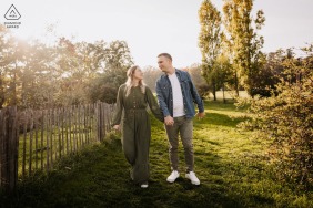 Surrounded by the crisp air and autumn sun, this couple shares a romantic moment at Parc de Lacroix-Laval in Marcy-l'étoile, Rhône, during their seasonal engagement portrait session in France.