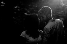 A loving couple enjoys a quiet connection during their engagement session in Bulle, Fribourg, Switzerland, surrounded by the charming and peaceful atmosphere of this historic and scenic Swiss region.