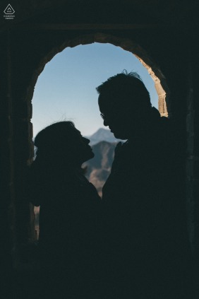 This timeless engagement portrait captures a couple at the Mutianyu Great Wall in Beijing, China, where they celebrate their upcoming marriage amidst the grand and ancient landscape of China.