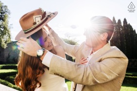 Bathed in golden light at Villa di Piazzano in Tuscany, the couple shares a playful and spontaneous interaction that highlights their deep joy and connection within the beautiful Italian countryside.