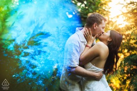A kiss is suspended between vibrant color and light in Ecoche, Haut Beaujolais, Loire, France, blending intimacy with surreal reflections during this artistic and creative pre-wedding photo session.