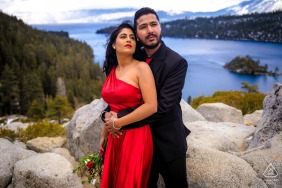Wrapped in elegance and quiet confidence, this engaged couple poses in South Lake Tahoe, California, with the scenic lake and rugged mountains stretching endlessly behind them during their portrait session.
