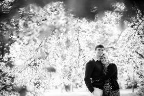 A couple’s portrait in London, UK, features a pair sharing a quiet session, their smiles glowing against a backdrop of London’s iconic nature scenes.