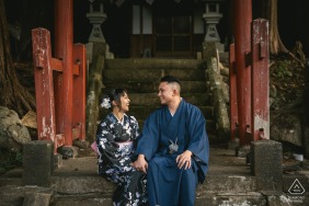 Laughing together beneath a torii gate in Aomori, Japan, the couple’s joy and connection shine in front of this iconic cultural backdrop, which adds a sense of place and tradition to their engagement session.