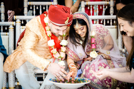Couple during wedding at Shree Swaminarayan Temple - Dharma Bhakti Manor Couple involved in traditions at Shree Swaminarayan Temple - Dharma Bhakti Manor (Stanmore), Wood Lane, Stanmore HA7 4LF, UK