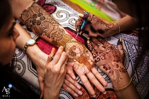 A detailed wedding art photo shoot featuring henna art applied to hands took place at The Taj Mahal Palace Hotel in Mumbai, India