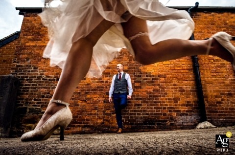 England Private farm wedding photos | The bride leaps over her new husband 