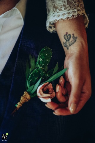 Lo de Marcos wedding art detail picture at Hacienda Antigua in Nayarit, Mexico of the brides tattoo and grooms boutonier