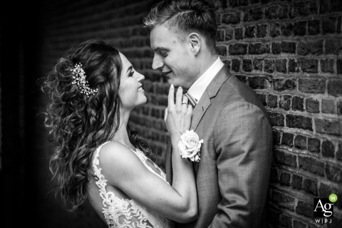 Black and white North Brabant wedding portrait in the Netherlands of the bride and groom having a nice minute together