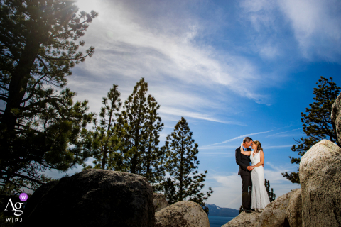 South Lake Tahoe wedding planning portrait ideas - CA photography of Bride and groom up on a rock posing on wedding day 