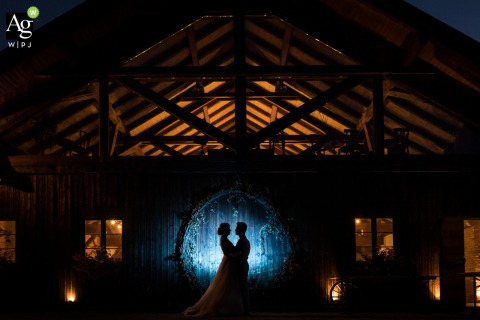 The couple lit up the night with a romantic blue light portrait session at a barn-like reception venue in Strasbourg, Bas-Rhin