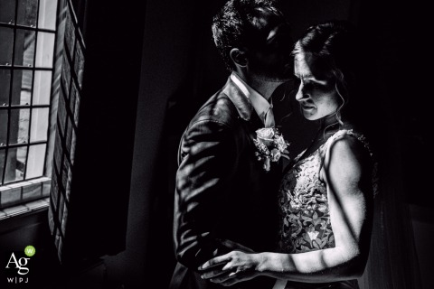 Beautiful natural light streams through the windows at the ceremony venue in Willemstad, Holland, moments after the vows, bringing warmth and clarity to the newly married couple.