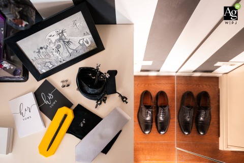Groom’s essentials are carefully arranged in a composition at a venue in Trieste, Italy, displaying the unique style and personal touches chosen for the wedding day.