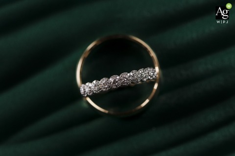 A macro image highlights the texture and shine of the wedding rings as the bride gets ready at Zephyr Palace, Villa Caletas Hotel in Jaco, Costa Rica.